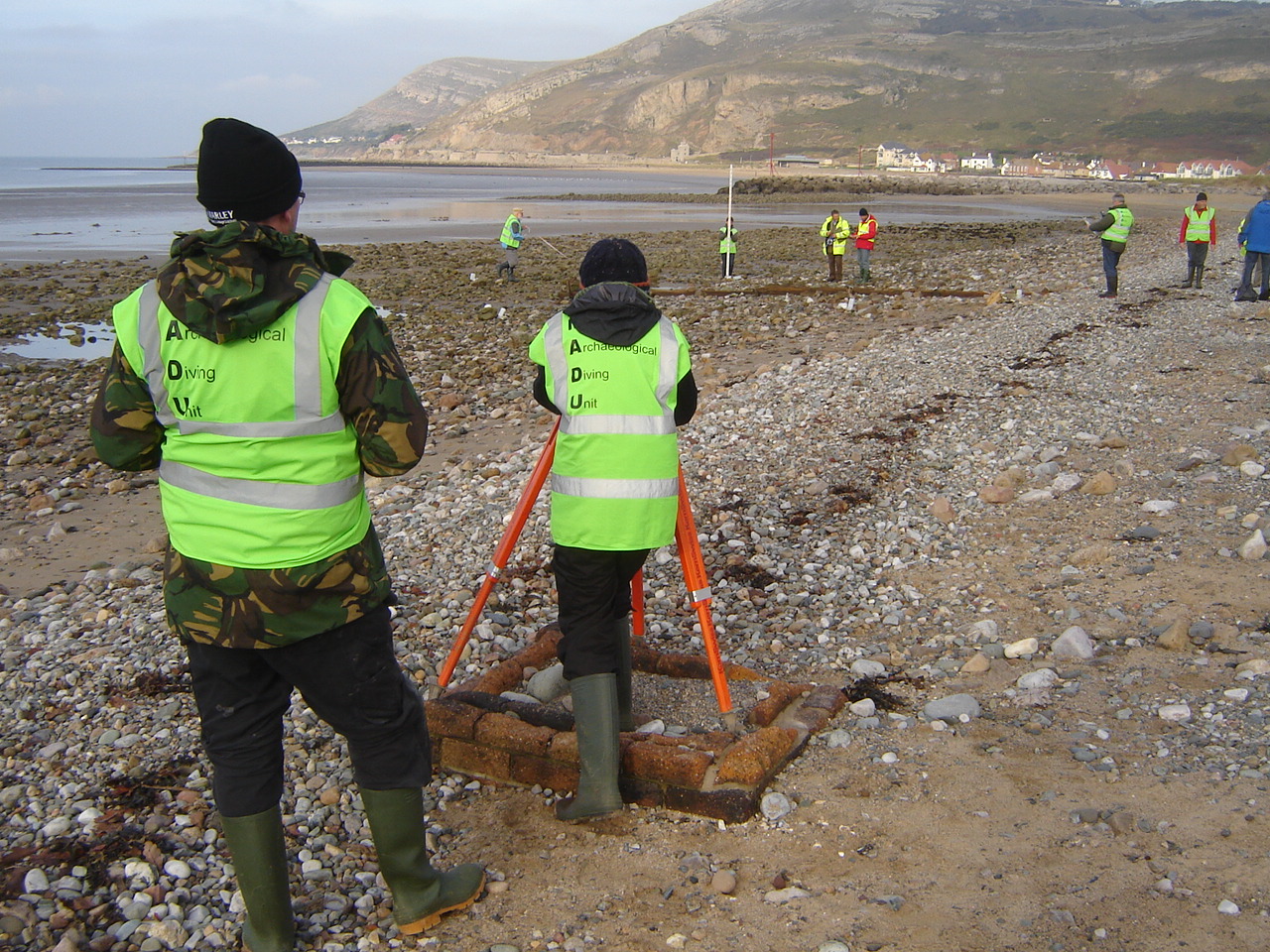 Volunteers from the Ships' Timbers Maritime Museum using a dumpy level on the site.